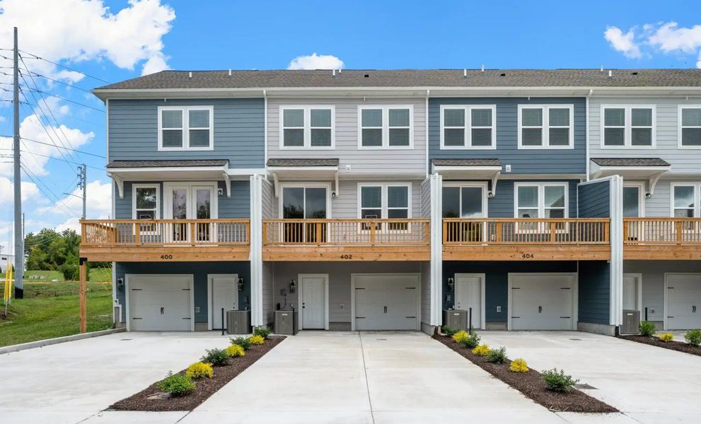 Front exterior of a home in the Portico Townhomes community, located in Smyrna, TN (Image 15).