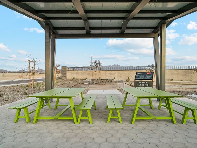 A group of tables and chairs outside. A group of tables and chairs outside.
