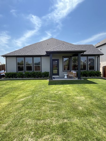 Charming single-story home with a manicured lawn in Tesoro at Chisholm Trail Ranch by Trophy Signature Homes (Fort Worth, TX). Charming single-story home with a manicured lawn in Tesoro at Chisholm Trail Ranch by Trophy Signature Homes (Fort Worth, TX).