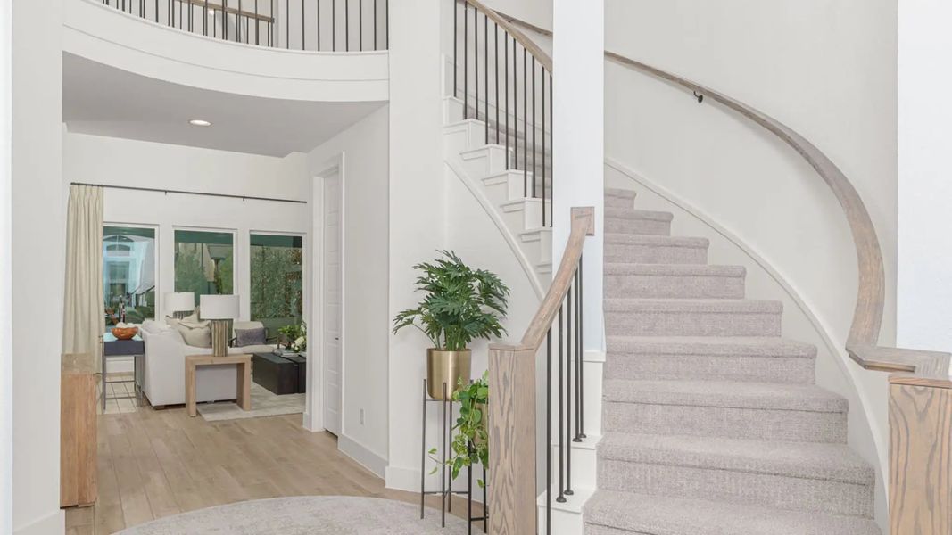 Furnished interior in a model home at Lakes Of Cane Island 60' in Katy (Image 5).