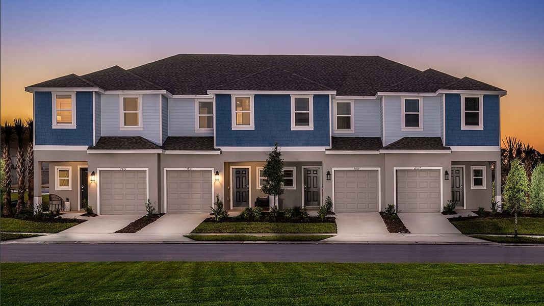 Front exterior of a home in the Waterstone Townhomes community, located in Groveland, FL (Image 1).