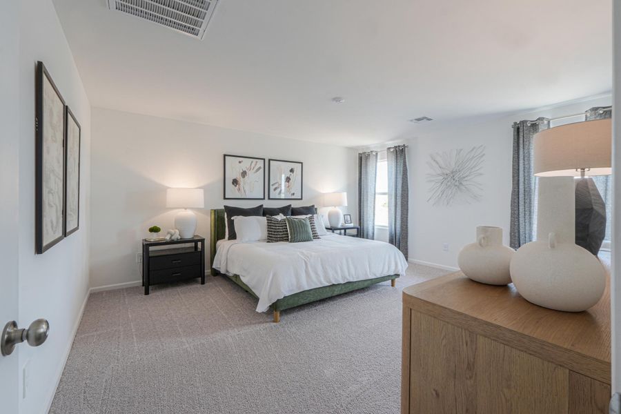 A bedroom with a bed and lamps. A bedroom with a bed and lamps.