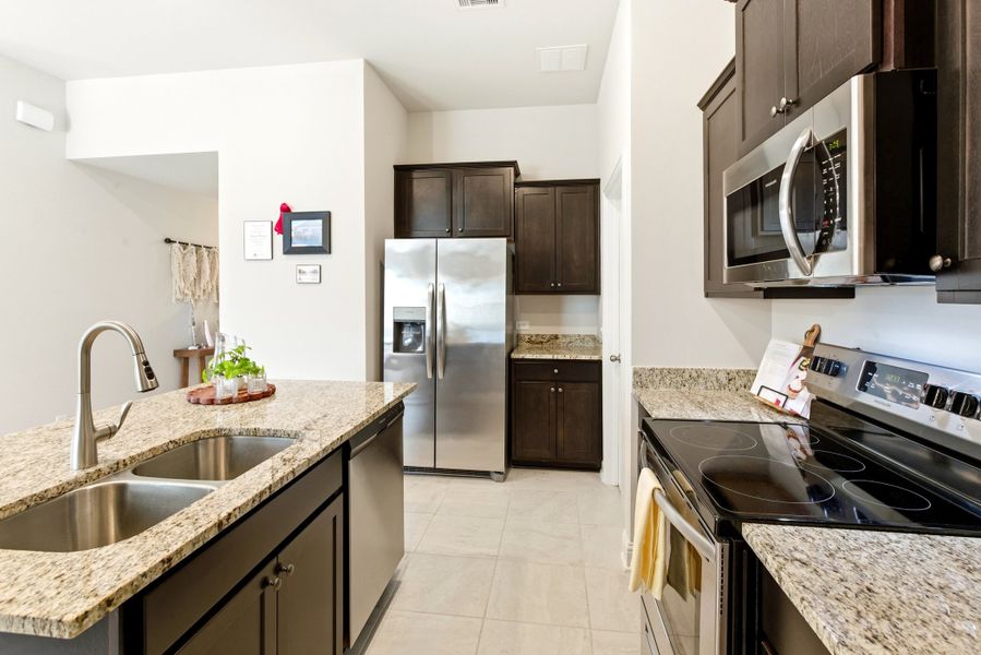Furnished interior in a model home at Kiber Reserve in Angleton (Image 18).