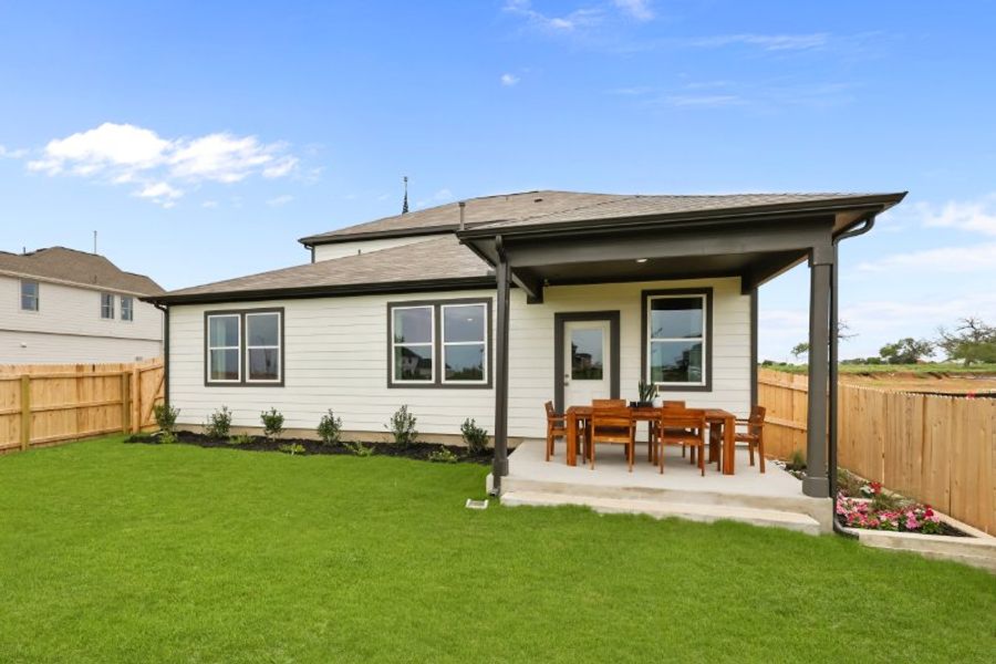 A house with a fence and lawn. A house with a fence and lawn.