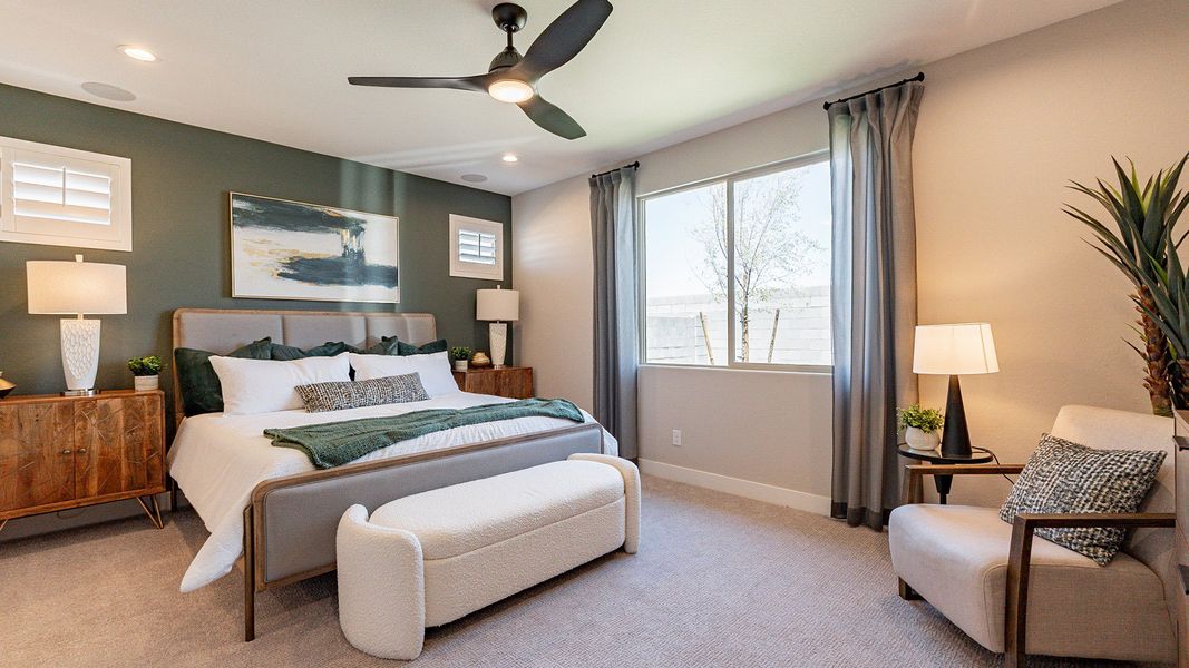 Experience luxury with a chic ceiling fan, neutral palette, and abundant light in Sienna Park's opulent bedroom.