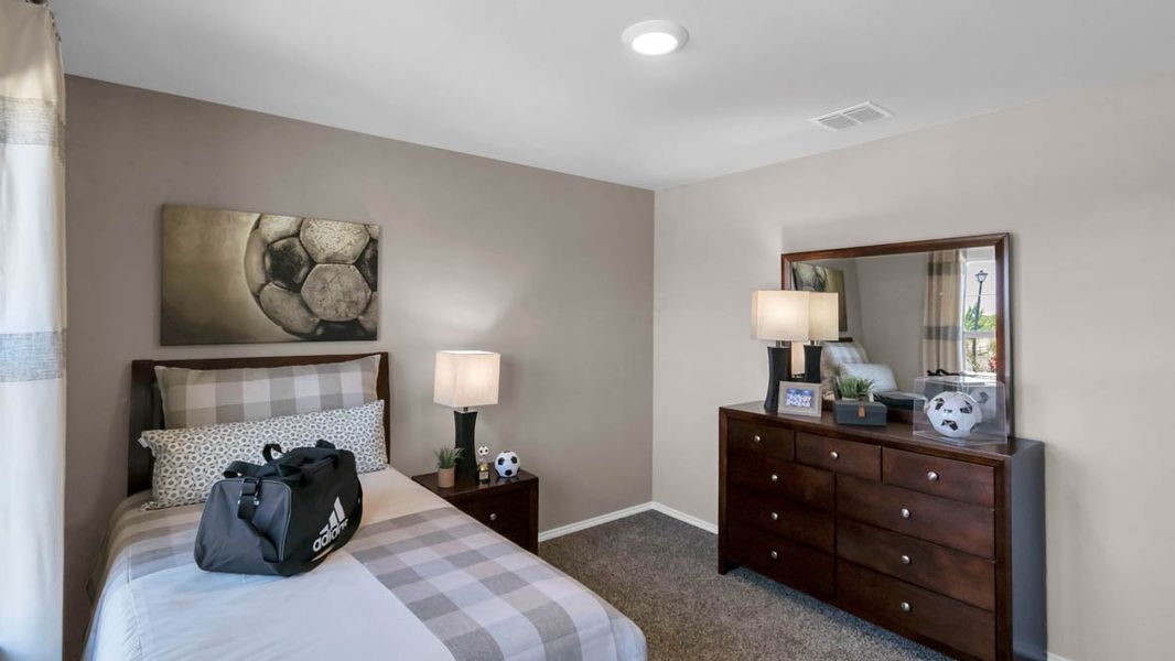 Furnished interior in a model home at Park Meadows in Lorena (Image 4).