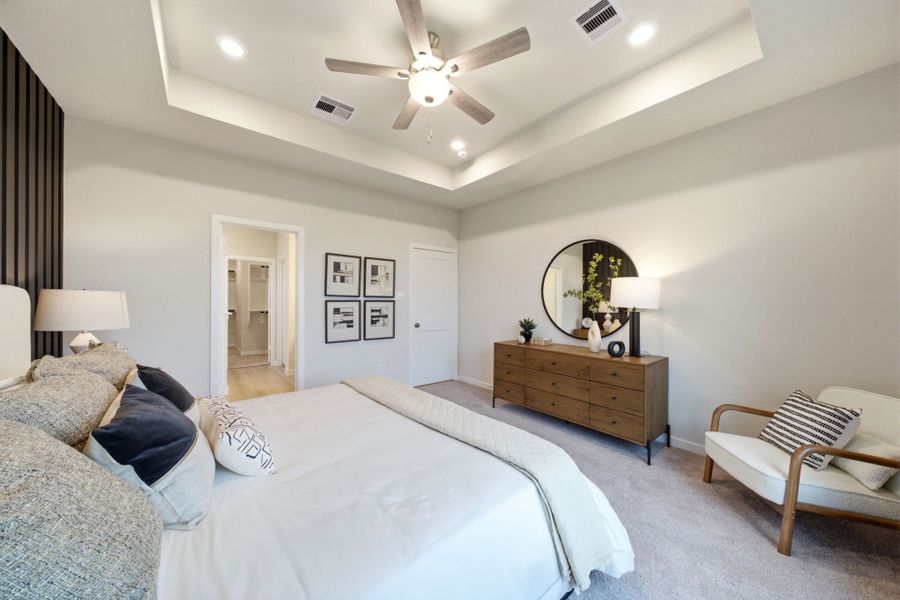 A bedroom with a bed and a chair. A bedroom with a bed and a chair.