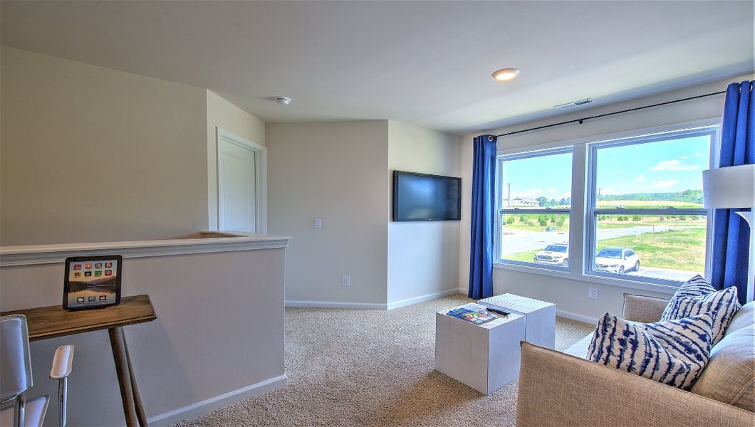 Furnished interior in a model home at Townes at Tap Root Farms in Fletcher (Image 27).