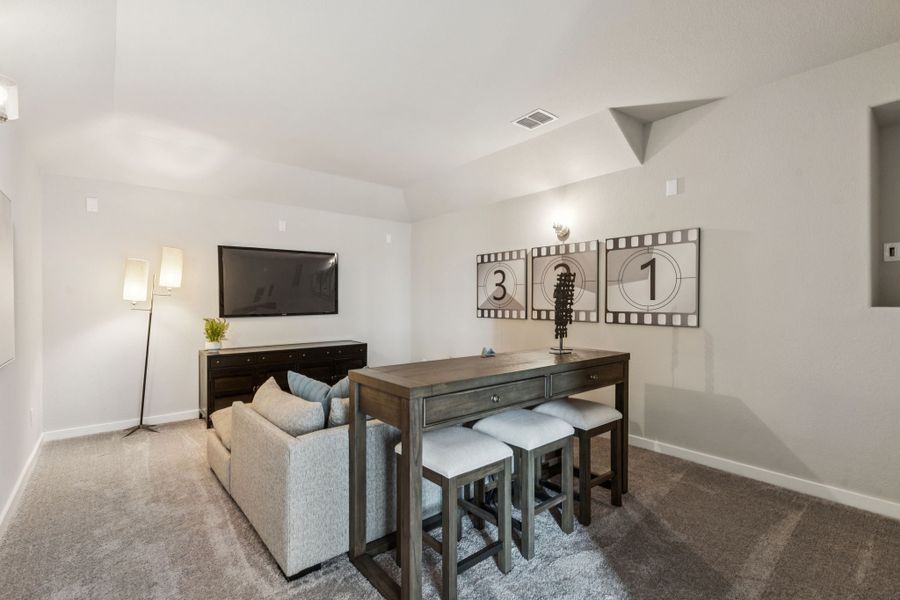REPRESENTATIVE PHOTO – Media Room in a Lakehaven Wimbledon model home in Farmersville TX by Trophy Signature Homes