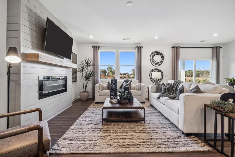 A living room with a fireplace.