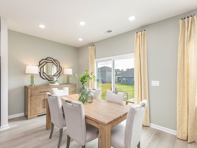 Dining area in the Chatham floorplan at a Meritage Homes community in Angier, NC.