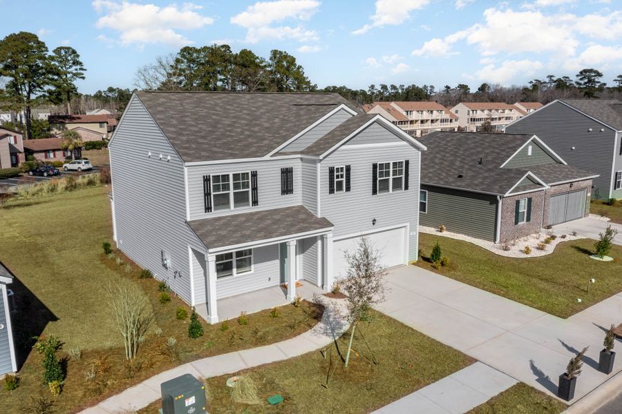 Front exterior of a home in the Island Green community, located in Myrtle Beach, SC (Image 13).