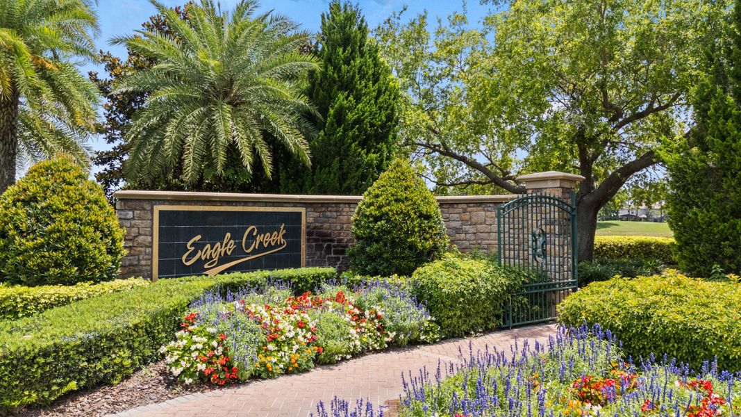 Eagle Creek community entrance in Lake Nona, FL, featuring a landscaped sign near Cyrene at Harmony. Eagle Creek community entrance in Lake Nona, FL, featuring a landscaped sign near Cyrene at Harmony.