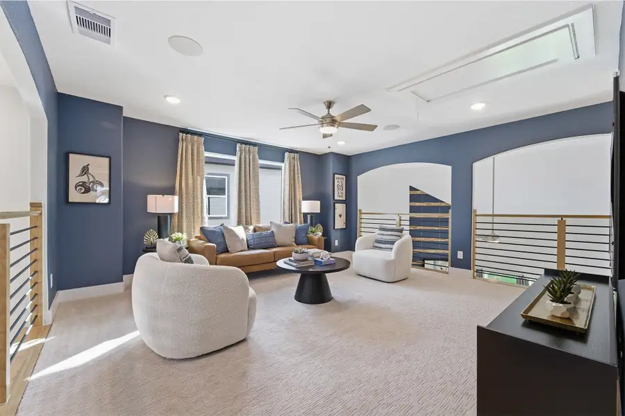 Furnished interior in a model home at Wildrye in Waller (Image 54).