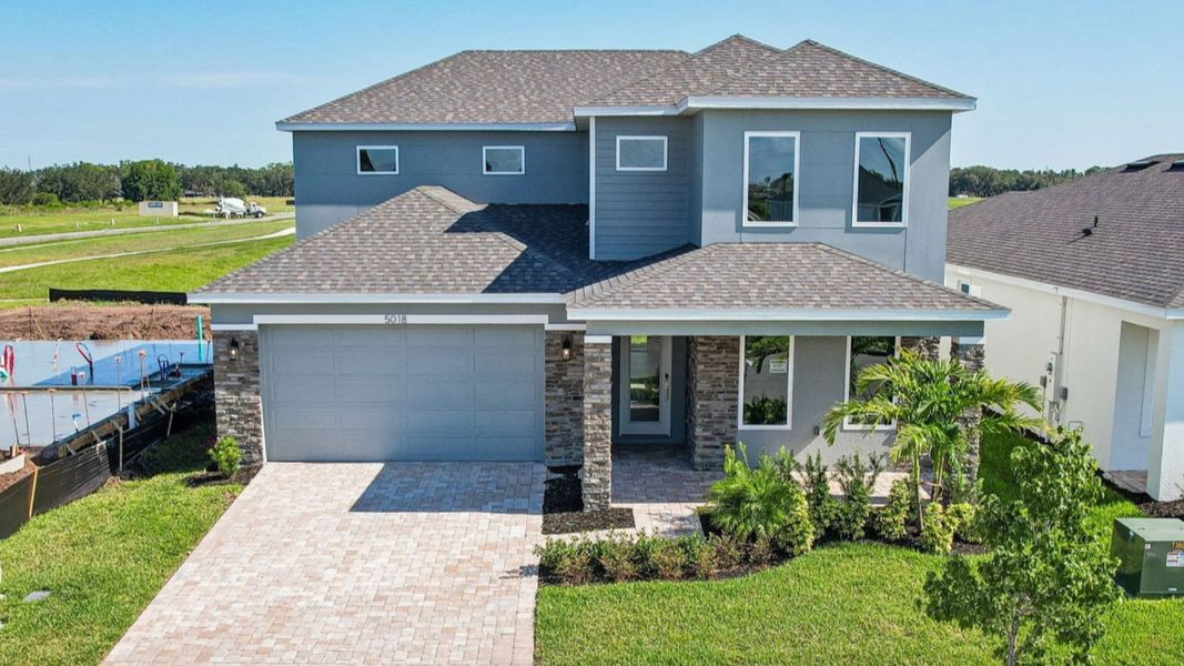 Front exterior of a home in the Lakeside at Satilla community, located in St. Cloud, FL (Image 13).