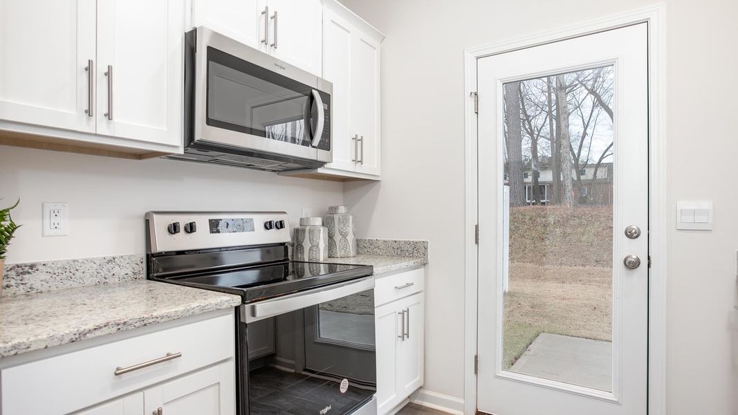 Furnished interior in a model home at The Townes at Riley's Meadow in Haw River (Image 9).