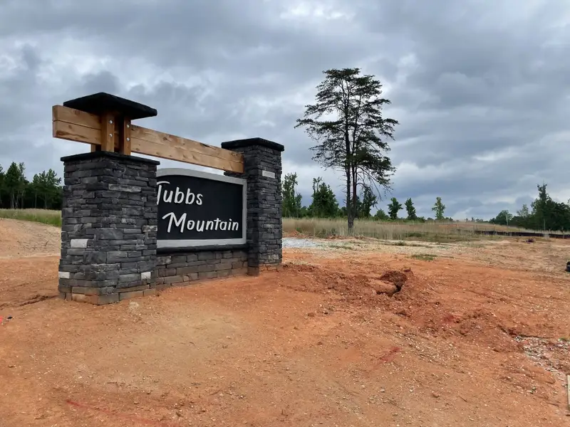 Entrance to the Tubbs Mountain Estates community in Travelers Rest, SC, featuring signage and landscaping (Image 1).