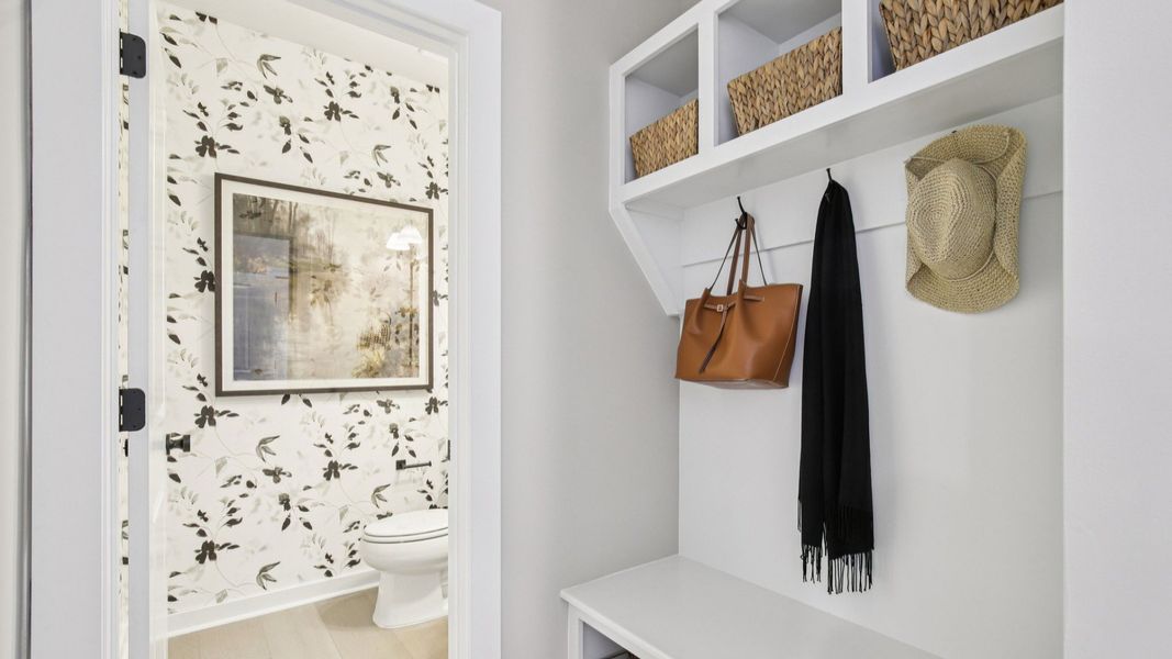 Built-in and painted Drop-Zone for convenience and storage with nearby Powder Room