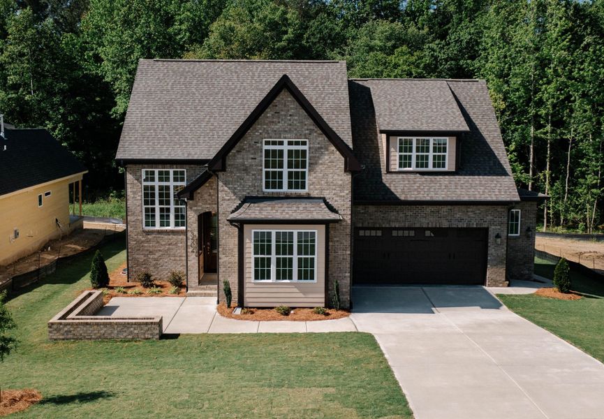 Front exterior of a home in the Forest Bluff Estates community, located in Fuquay Varina, NC (Image 12). Front exterior of a home in the Forest Bluff Estates community, located in Fuquay Varina, NC (Image 12).