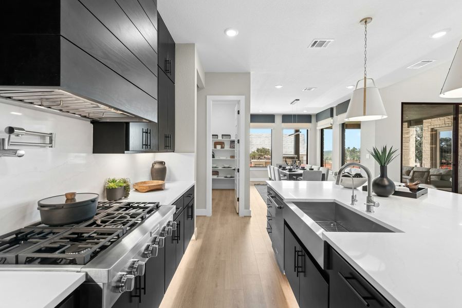 Furnished interior in a model home at Caliterra in Dripping Springs (Image 32).