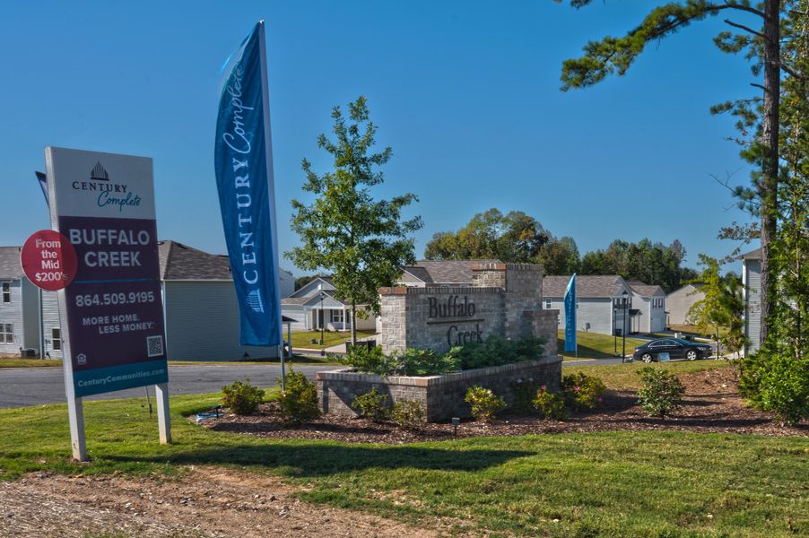 A sign in front of a building. A sign in front of a building.