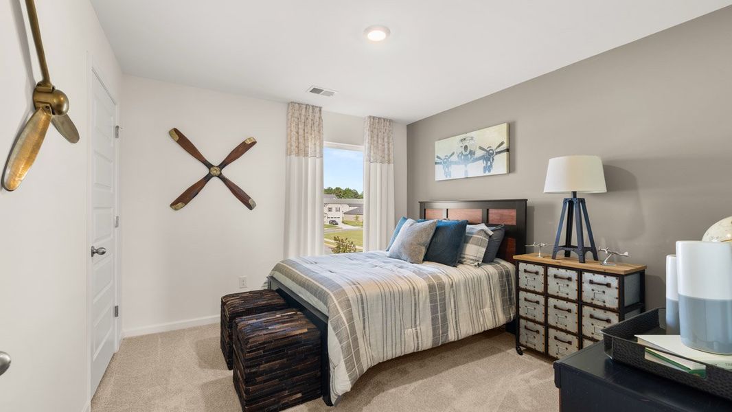 Furnished interior in a model home at Preserve at Dove Creek in Statham (Image 21).