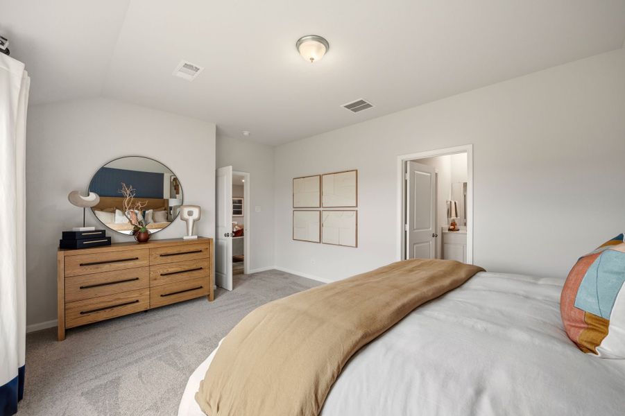 A bedroom with a bed and a dresser. A bedroom with a bed and a dresser.