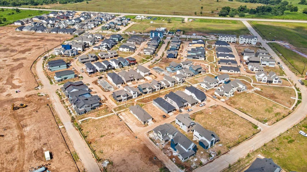 Aerial view of the Indigo: 40ft. lots community in Richmond, TX, showing layout and nearby surroundings (Image 13). Aerial view of the Indigo: 40ft. lots community in Richmond, TX, showing layout and nearby surroundings (Image 13).