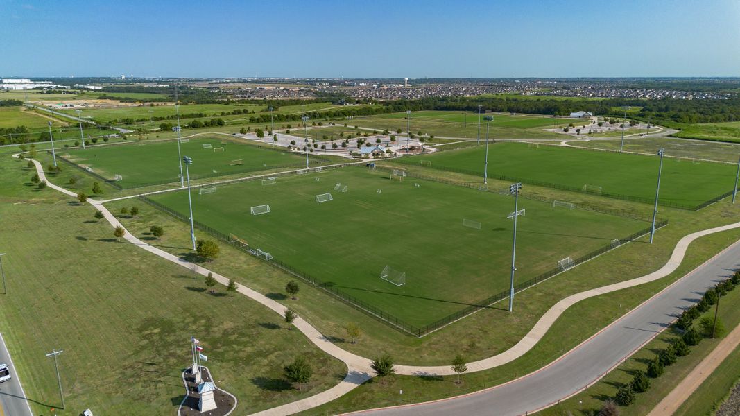 Aerial view of the Lakeside Meadows community in Pflugerville, TX, showing layout and nearby surroundings (Image 13). Aerial view of the Lakeside Meadows community in Pflugerville, TX, showing layout and nearby surroundings (Image 13).