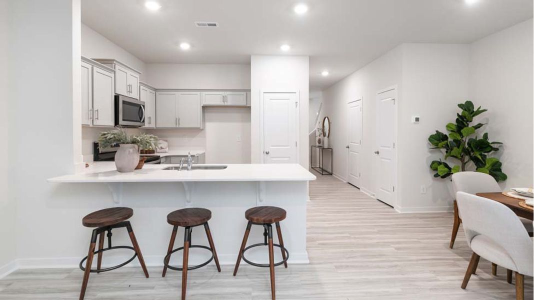 Furnished interior in a model home at The Townes at Troutman in Troutman (Image 4).