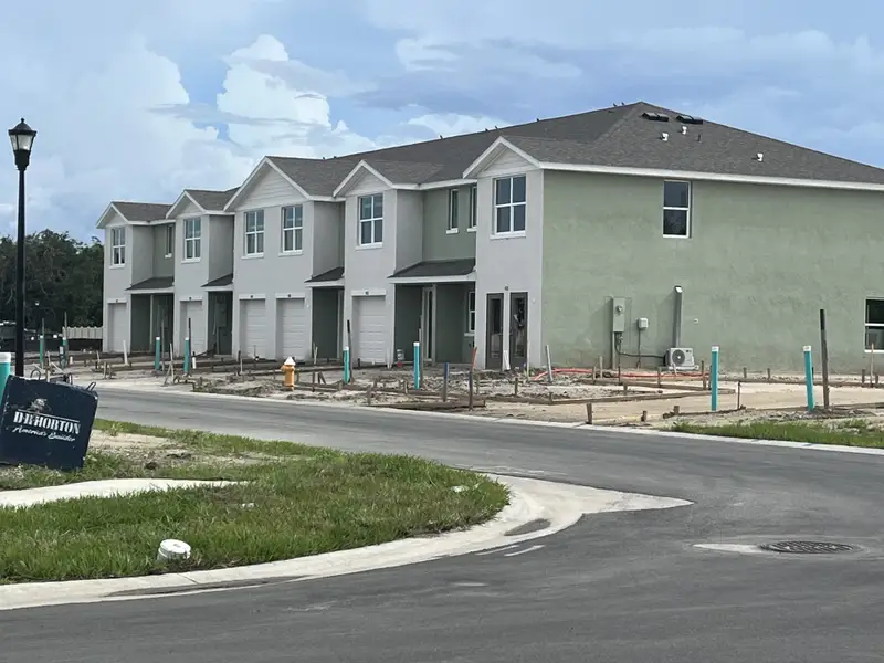 Modern townhomes under construction with sleek design in Ruskin Reserve by D.R. Horton (Ruskin, FL).