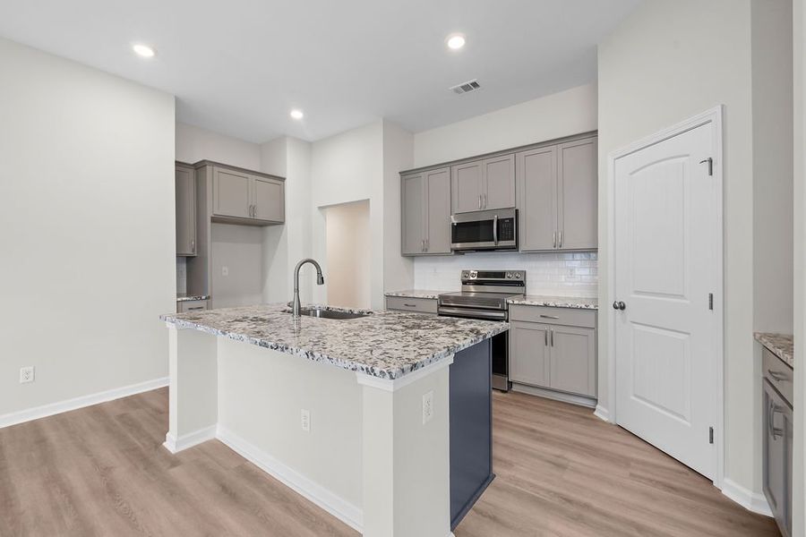 Furnished interior in a model home at Woodland Cove in Brunswick (Image 5).
