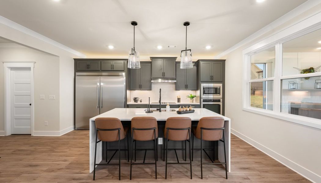 Furnished interior in a model home at Pinecrest Ridge in Dacula (Image 22).