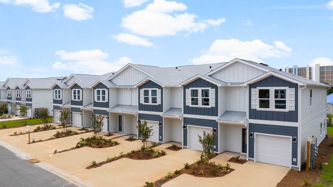 Front exterior of a home in the Caballeros Estates Townhomes at Hombre community, located in Panama City Beach, FL (Image 2).