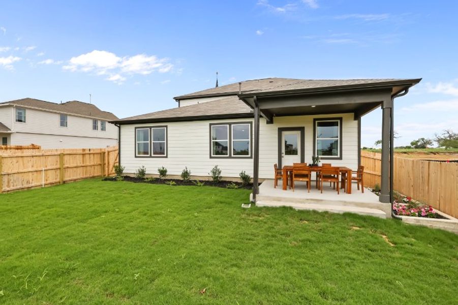 A house with a fence and lawn. A house with a fence and lawn.