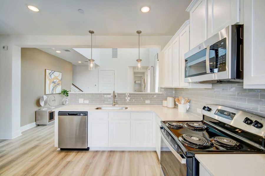 Furnished interior in a model home at Avery Centre in Round Rock (Image 36).