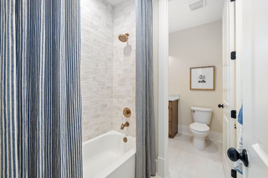 Furnished interior in a model home at Hidden Creek at SilverLeaf 80' Gold Series in St. Augustine (Image 76).