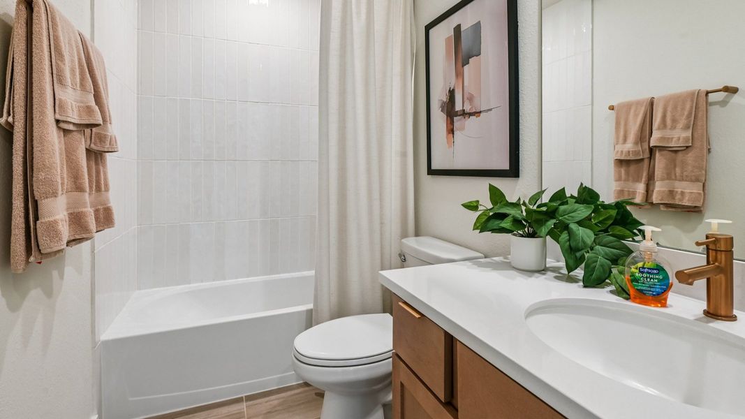 Immerse in luxury with sleek gold fixtures, refined wood accents, and contemporary design in Cielo.