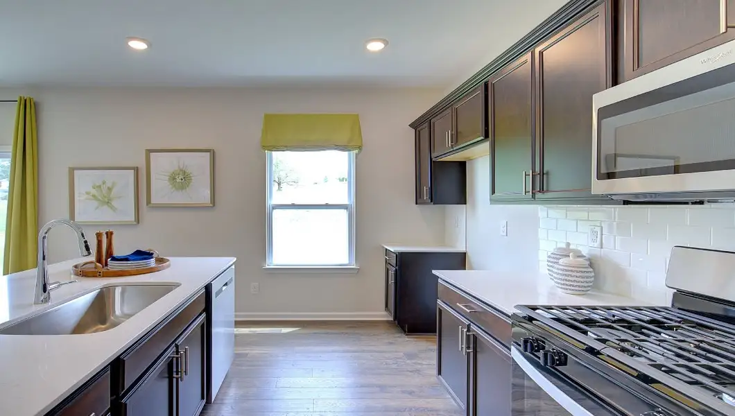 Furnished interior in a model home at Tap Root Farms in Fletcher (Image 5).