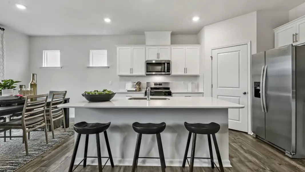 Furnished interior in a model home at Cross Creek in Spring Lake (Image 3).