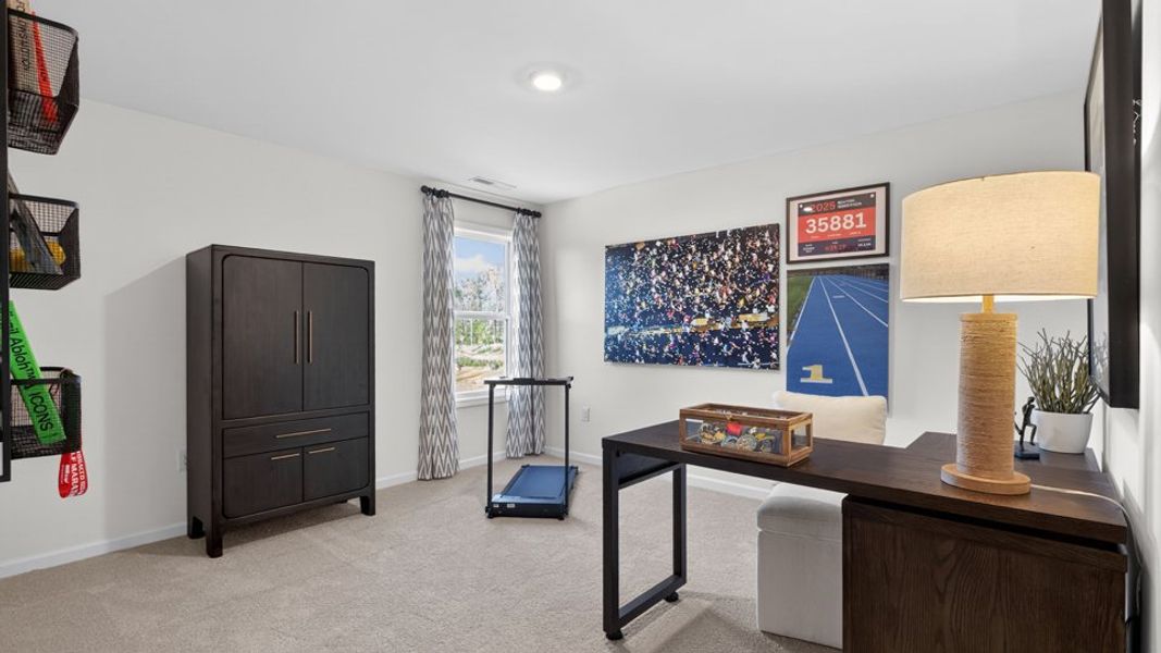 Furnished interior in a model home at The Grove at Winston Pointe in Clayton (Image 28).