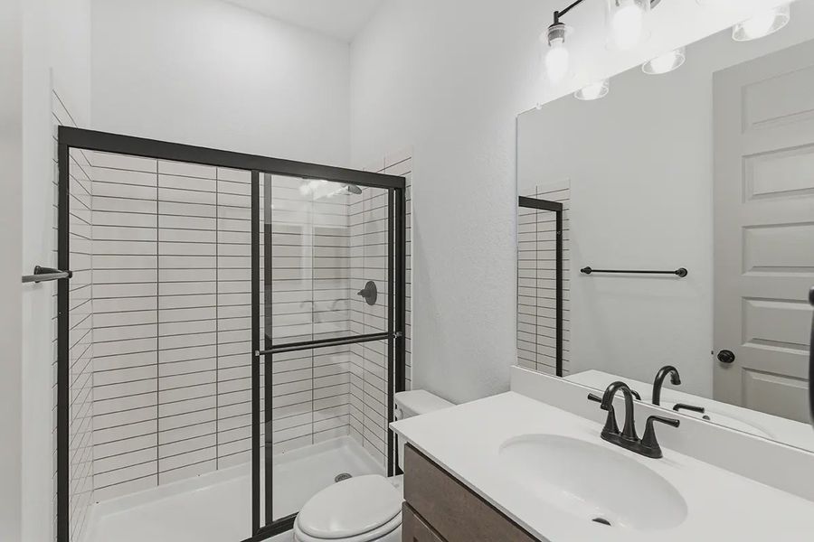 Furnished interior in a model home at Grand Lakes Estates in Montgomery (Image 12).