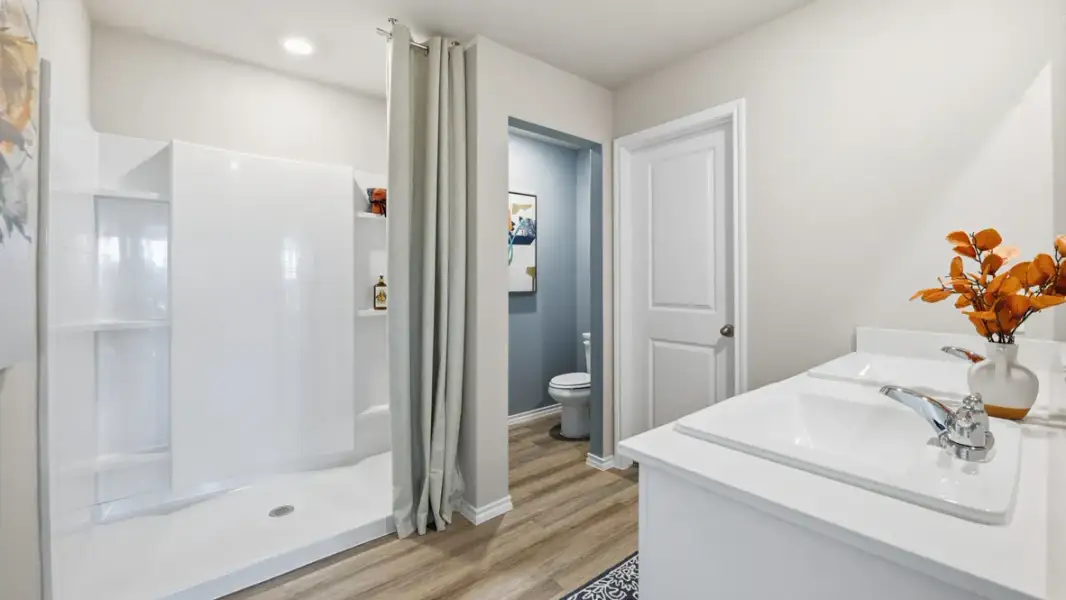 Furnished interior in a model home at Webster Meadows in Ponder (Image 13).