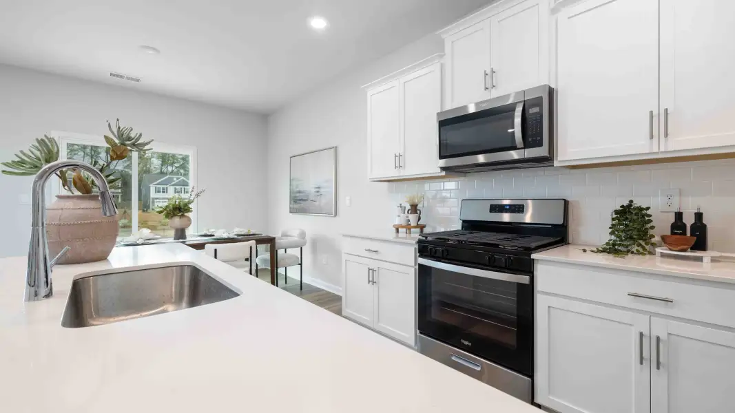 Furnished interior in a model home at Sweetwater Village in Rockwell (Image 10).