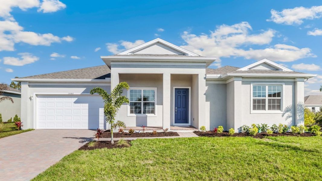Front exterior of a home in the Cape Coral Spot - Tradition community, located in Cape Coral, FL (Image 9).