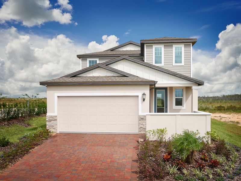 Front exterior of a home in the Springs at Lake Alfred - Classic Series community, located in Lake Alfred, FL (Image 2). Front exterior of a home in the Springs at Lake Alfred - Classic Series community, located in Lake Alfred, FL (Image 2).