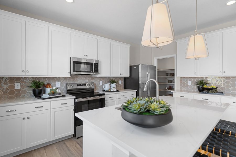 Furnished interior in a model home at The Cottages Collection at Mead Crossing in Mead (Image 5).