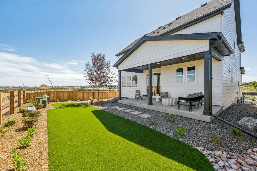 A house with a fence and a yard. A house with a fence and a yard.