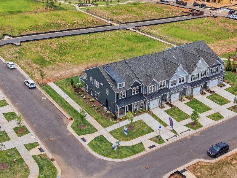 Aerial view of the Blythe Mill Townhomes community in Waxhaw, NC, showing layout and nearby surroundings (Image 11). Aerial view of the Blythe Mill Townhomes community in Waxhaw, NC, showing layout and nearby surroundings (Image 11).