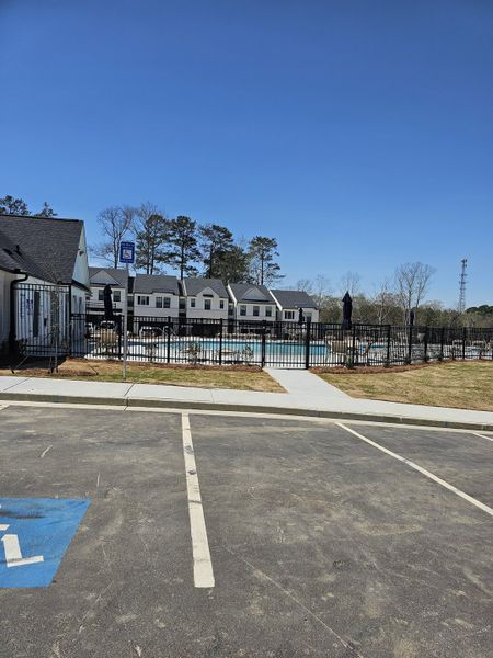 A scenic view of Azalea Square Townhomes by Century Communities with a pool and neat surroundings (Lawrenceville, GA). A scenic view of Azalea Square Townhomes by Century Communities with a pool and neat surroundings (Lawrenceville, GA).